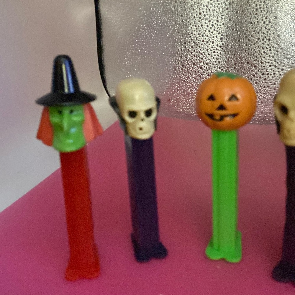 PEZ. Halloween dispensers a witch skull pumpkin bigger skull & wolf?
